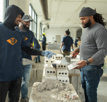 PTI students practicing masonry